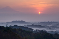 Sunrise at Setumbu hill with the view of Borobudur and Merapi
